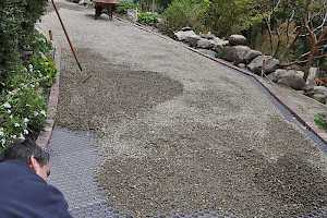 With the CORE Gravel grid foundation in place gravel is spread over the hexagonal shaped cells.